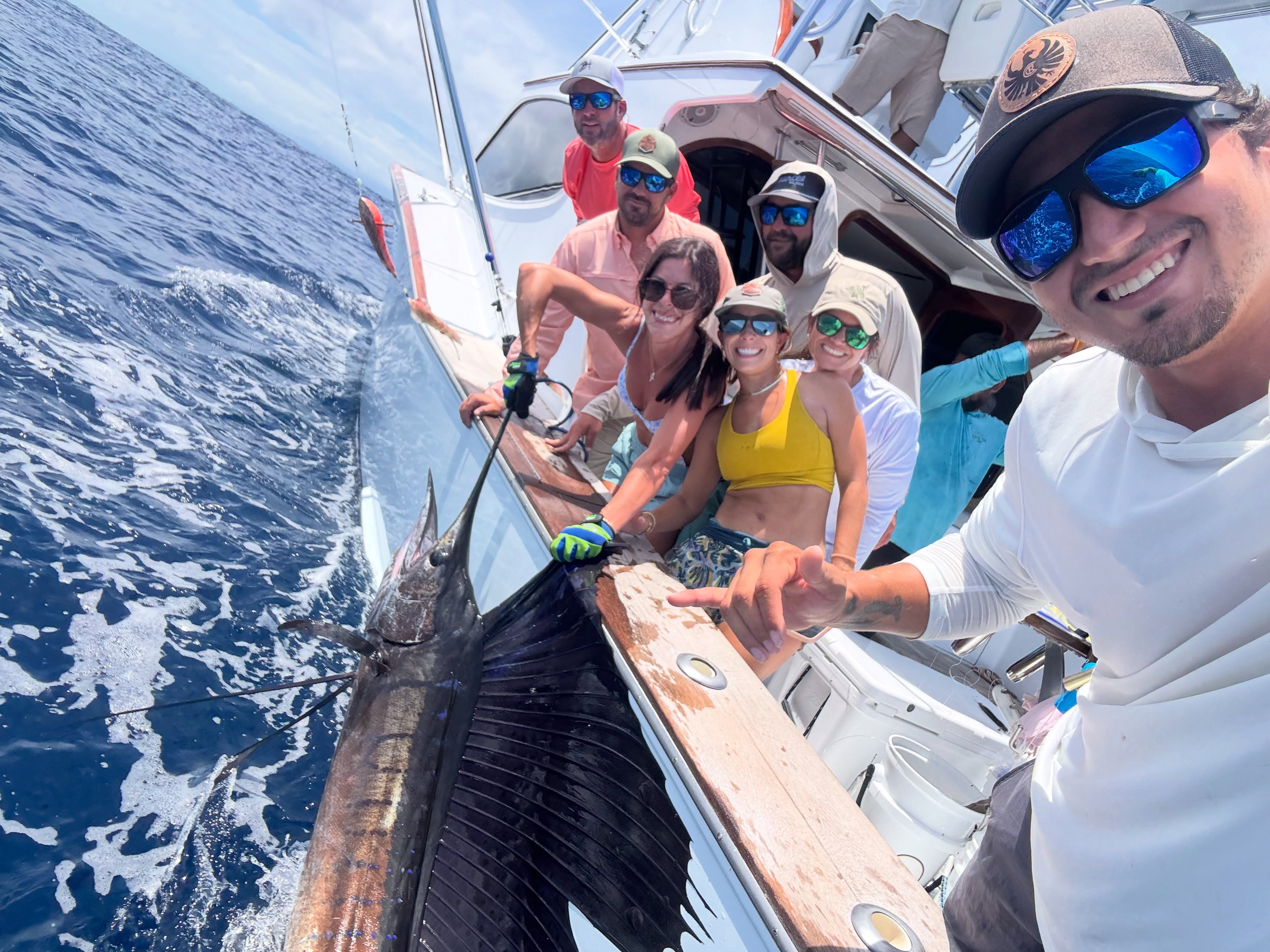 Happy Tiger Fly guests with a sailfish